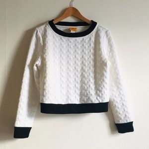 White quilted crop sweater with black trim